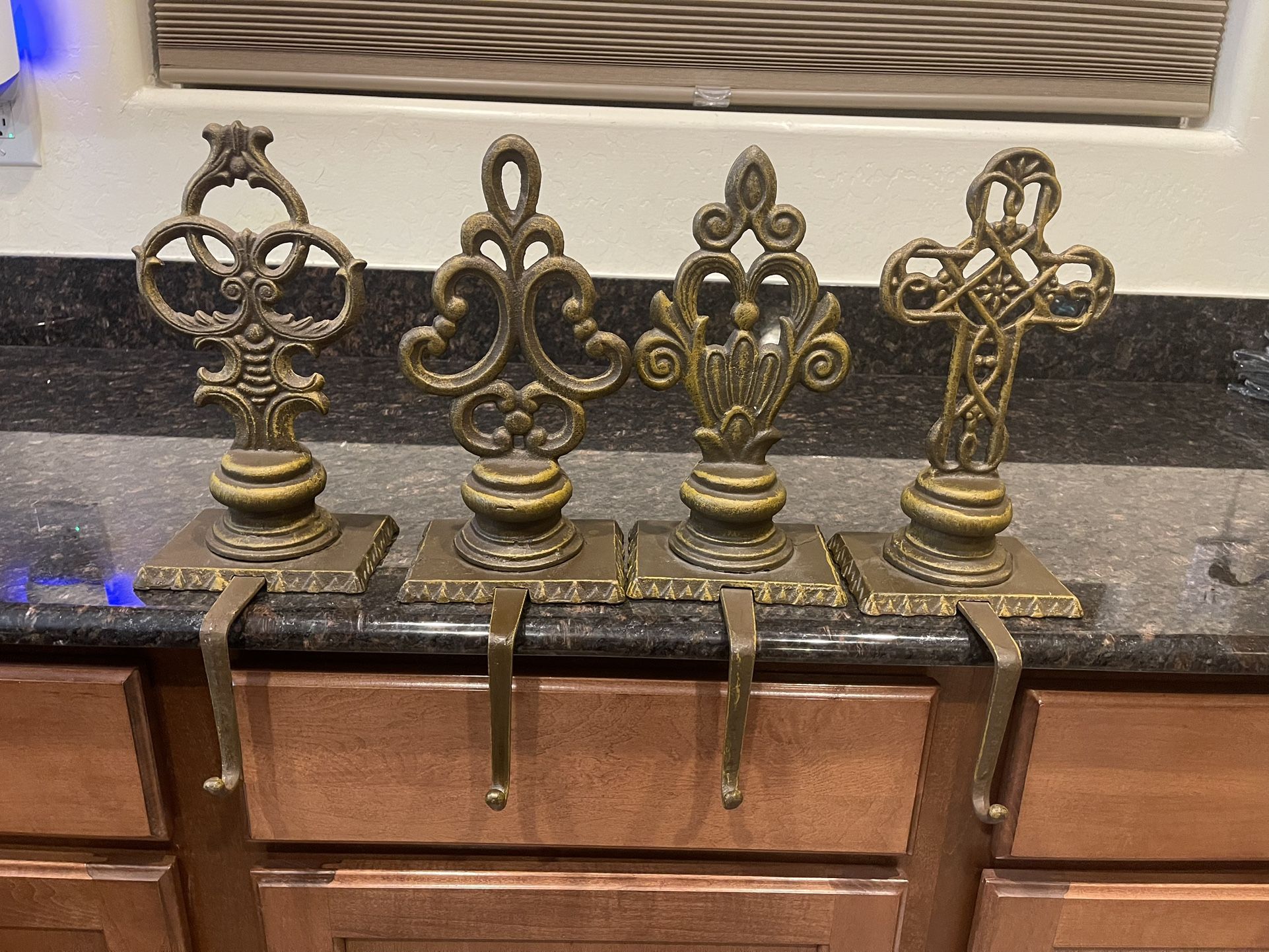 4 Vintage cast iron stocking holders