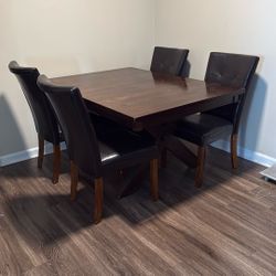 Dining Table With 4 Chairs It's Expandable .