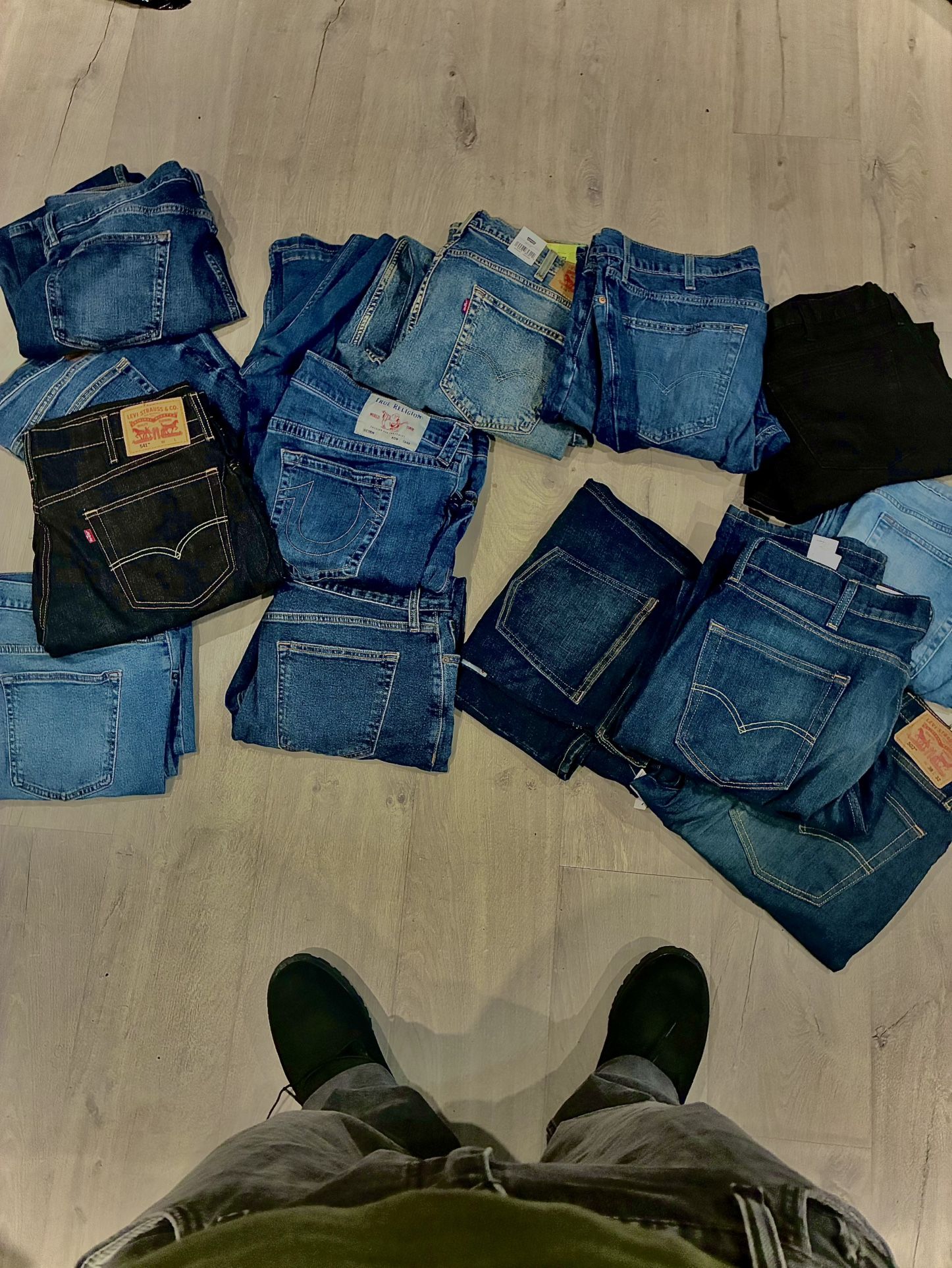 Multiple Pairs Of Jeans That Range From Multiple Sizes.