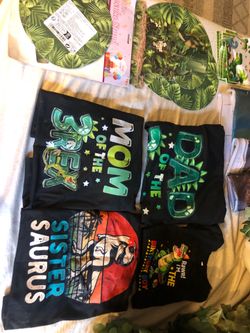 Dinosaur party decorations and shirts