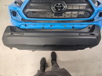 Toyota Lower front lip and rear bumper cover.
