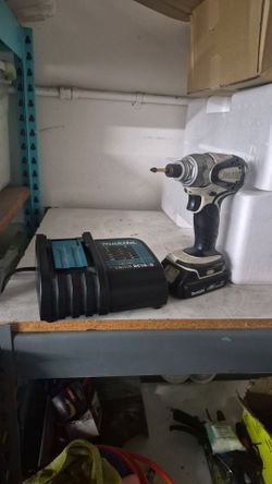 Makita impact drill with charger and battery