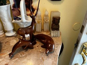 Three wood animal figurines