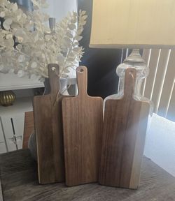 Three rectangular wooden charcuterie/cutting boards.