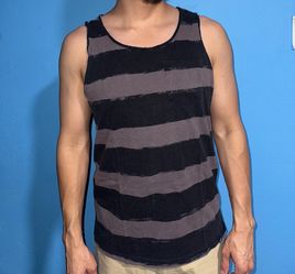 Black and grey striped tank top with a unique design  Sizing has faded but can fit small or possibly medium   Modeled on 5’4, ~140 lb build for refere