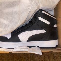 Puma black & white high tops size 11.5 