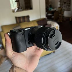 Sony a6400 camera with 30mm sigma lens with soft case