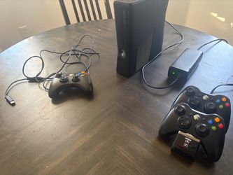Xbox 360 Slim Console with 3 Controllers and a charging dock