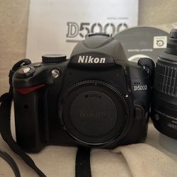 Mint Nikon d5000 with kit lens. Low shot count