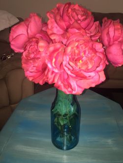 Blue glass vase and flowers artificial