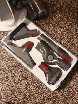 Broken Dyson with bunch of attachments