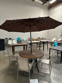 Moving Sales!! New 6 pcs Outdoor Patio 47” Round Dining Table + 4 Chairs and 10’ Solar LED Light Umbrella