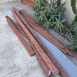 Red Stained Dog Ear Fence Pickets