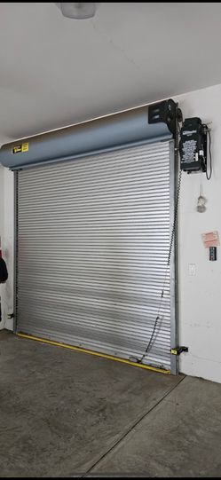 New hardly used  Commercial roll up door and LiftMaster motor .  