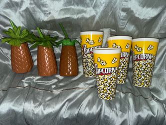 3 plastic pineapple drinking containers & 4 popcorn cups