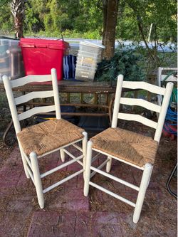 Two wicker bottom chairs