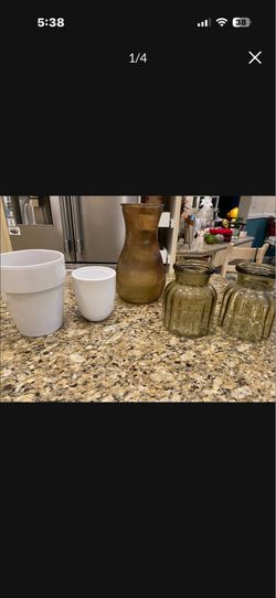 Two ceramic planters, one large glass Vase  two medium size matching vases no cracks no chips