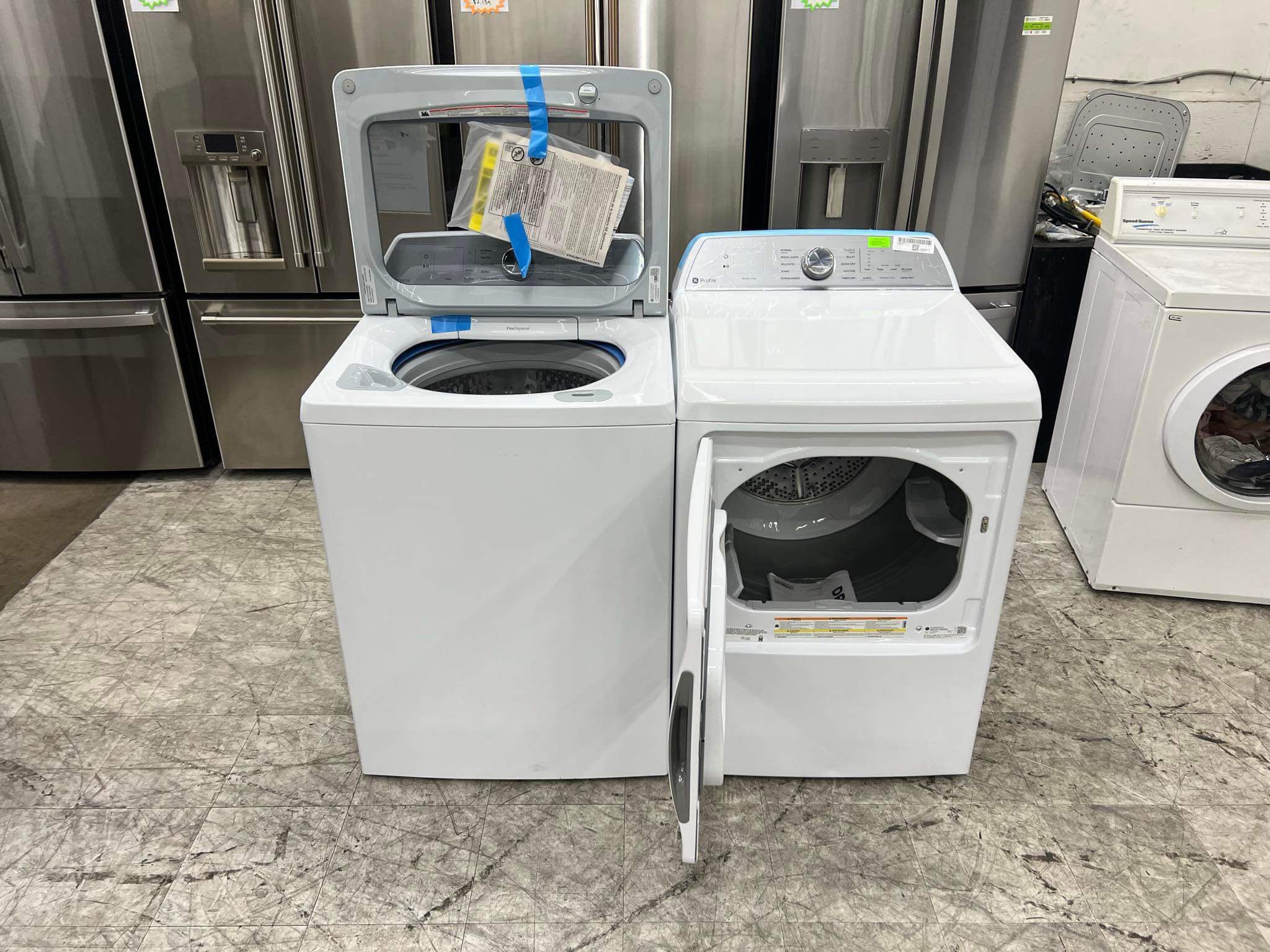 GE Profile 4.9 cuft top load washer and gas dryer with agitator