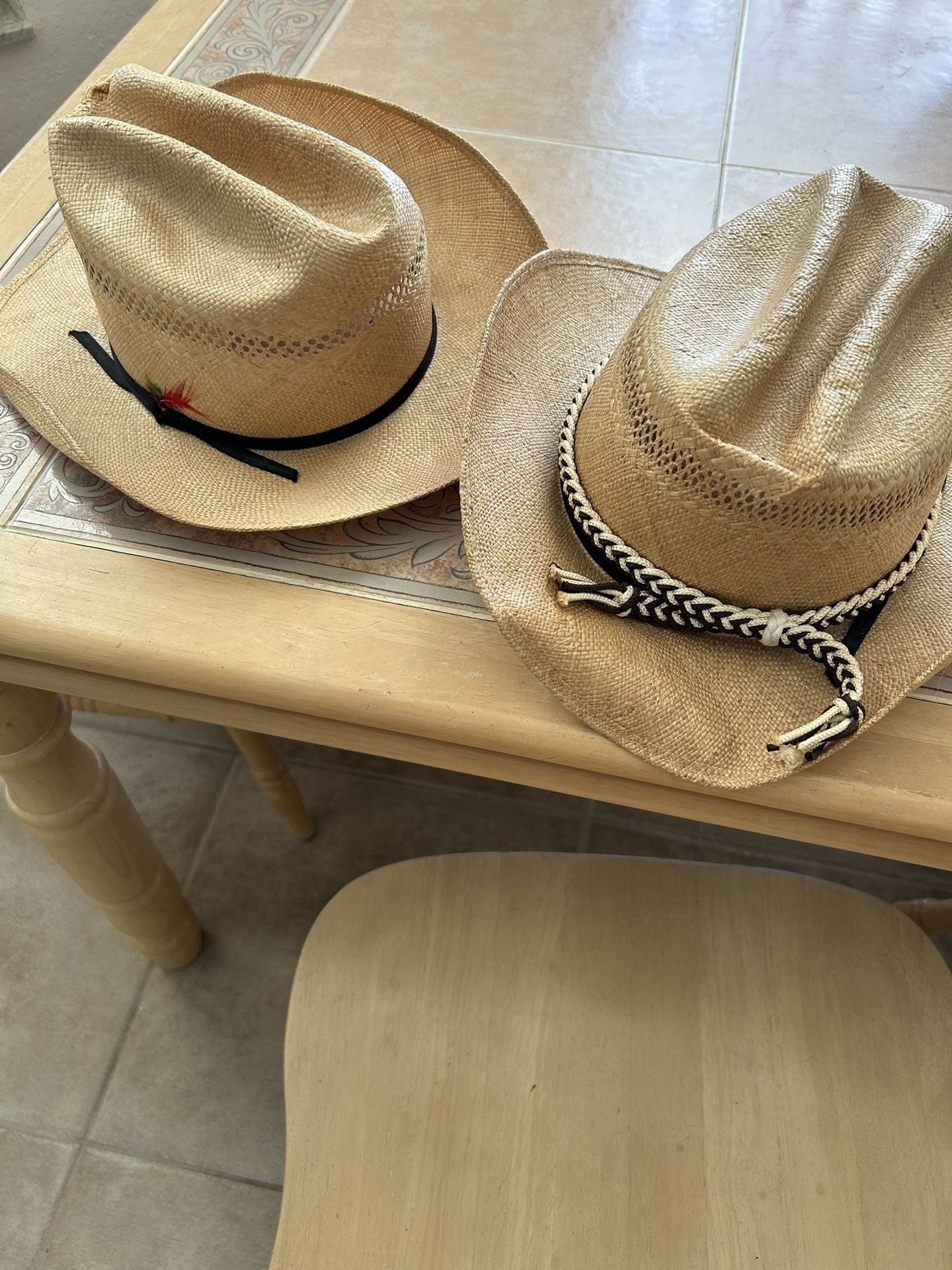 Two straw cowboy hats