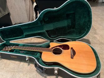 Yamaha Acoustic-Electric Cutaway Guitar with Hard Case