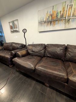 Brown leather sofa and loveseat