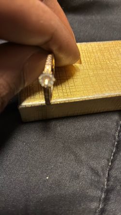 Gold Solitaire Ring with Side Stones