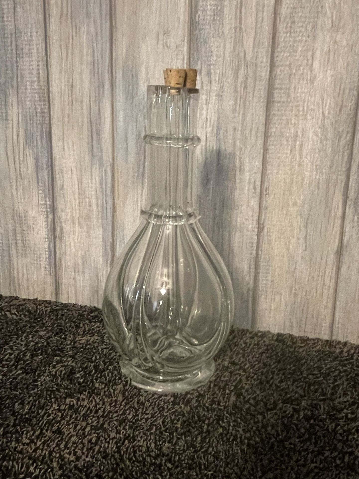 This is a vintage four-chamber glass liquor decanter
