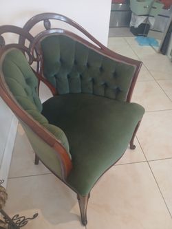 Two velvet green antique chairs