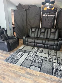 Black Leather Reclinable sofas with cup holders and storage