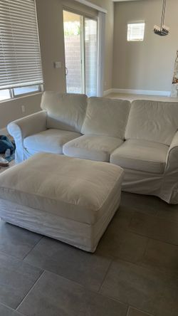 White slipcover couch w ottoman