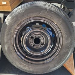 BRAND NEW RIM AND SPARE TIRE 