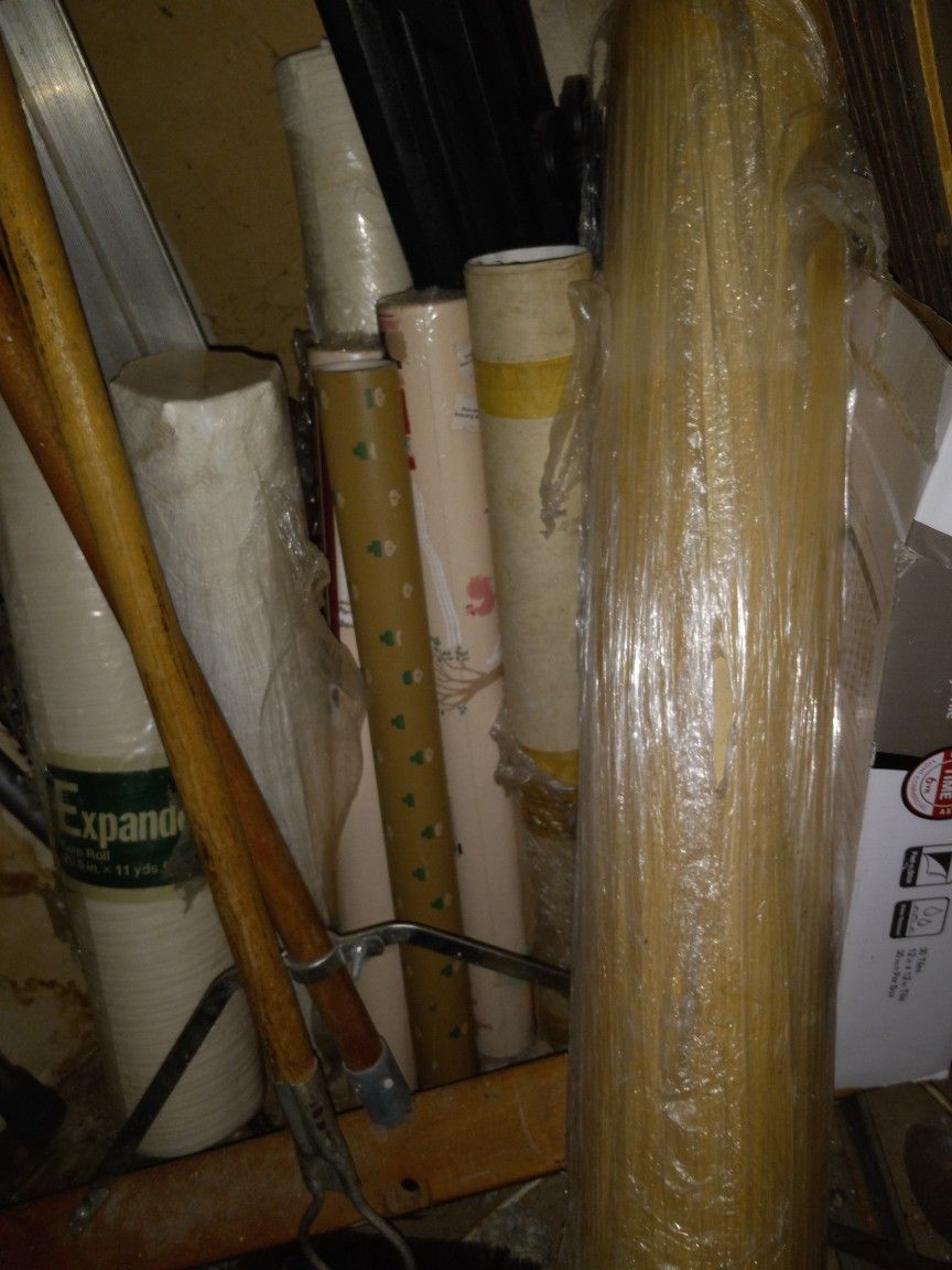 Wall Paper Rolls And Big Roll Of Canvas.