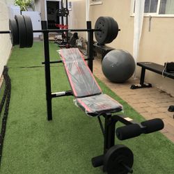 Gym Equipmentt bench press with 100lb weight set Combo With leg extension