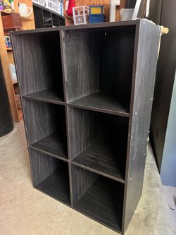 Selling 3 black 6-cube storage organizers in good condition. • Sturdy and stable • Modern black wood finish • 6 spacious storage cubes • Perfect for