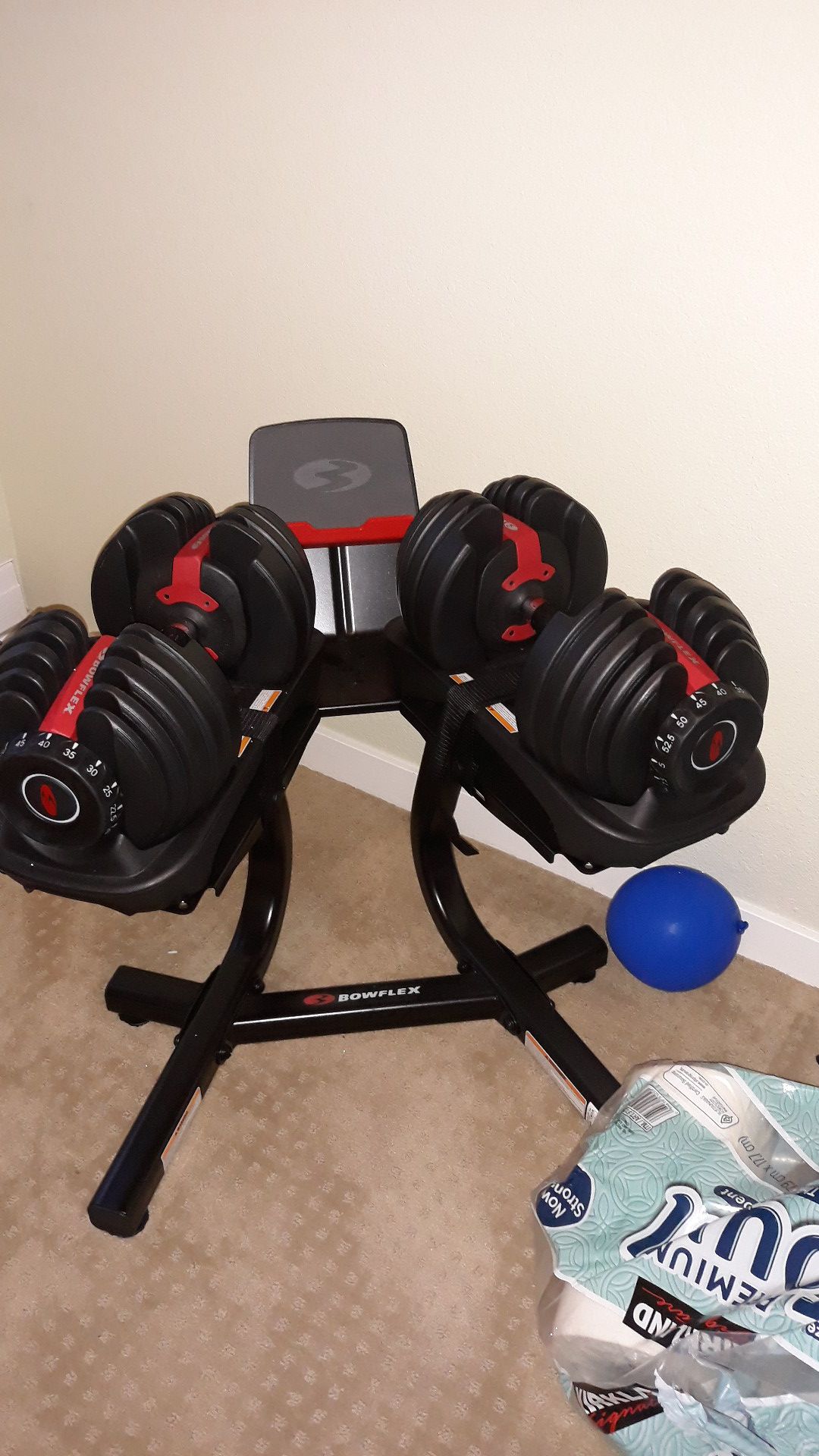 Bowflex dumbbells 552lbs with stand and bench. Excellent condituons