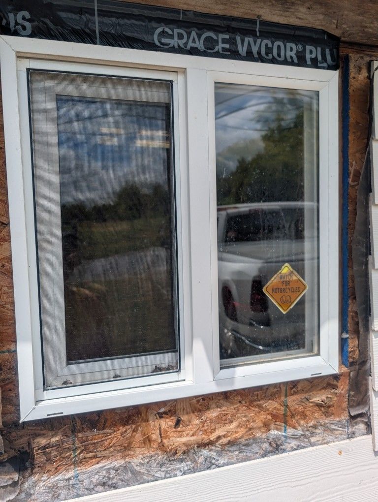 One 1'-11" SQ. Vinyl Window & one 2'-4"x 7'0" Door