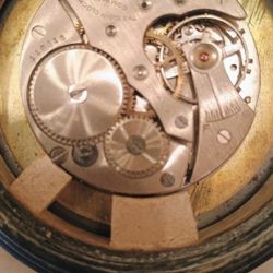 Vintage 7 Jewels Car Clock stamped The Elgin clock company Hunter.  the clock winds but is not currently keeping time we'll need to be reset. See our 