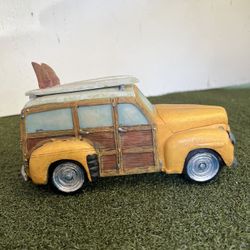 collectible figurine of a 1948 Woody Station Wagon with surfboards on top
