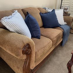 Tan couch with wood trim
