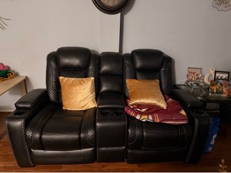 Black 2-seat reclining loveseat with center console and LED