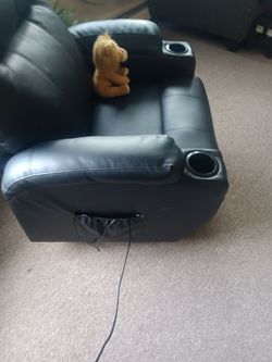 Remote controlled black recliner with lift