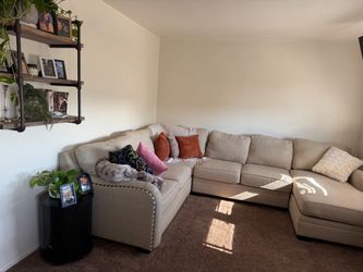 U shaped couch with chase