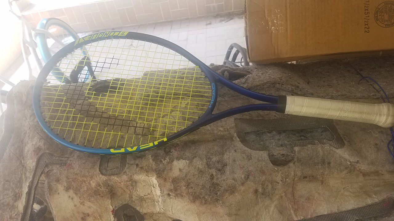 2 used tennis rackets