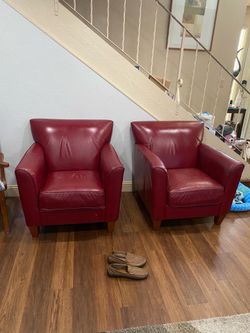 2 lazy boy red leather chairs