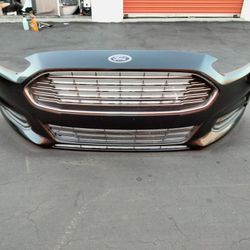 2013-2016 Ford Fusion Complete Front Bumper With All The Accessories OEM.