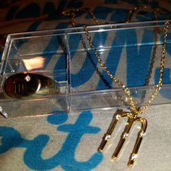 14 Karat Ring With Diamond In It And 14 Karat Necklace With M With Diamonds In It