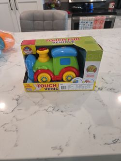 BRAND NEW TOUCH FUN VEHICLE WITH LIGHTS & SOUNDS SEE DESCRIPTION 