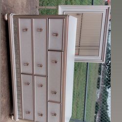 Bed with mattress and dresser with mirror