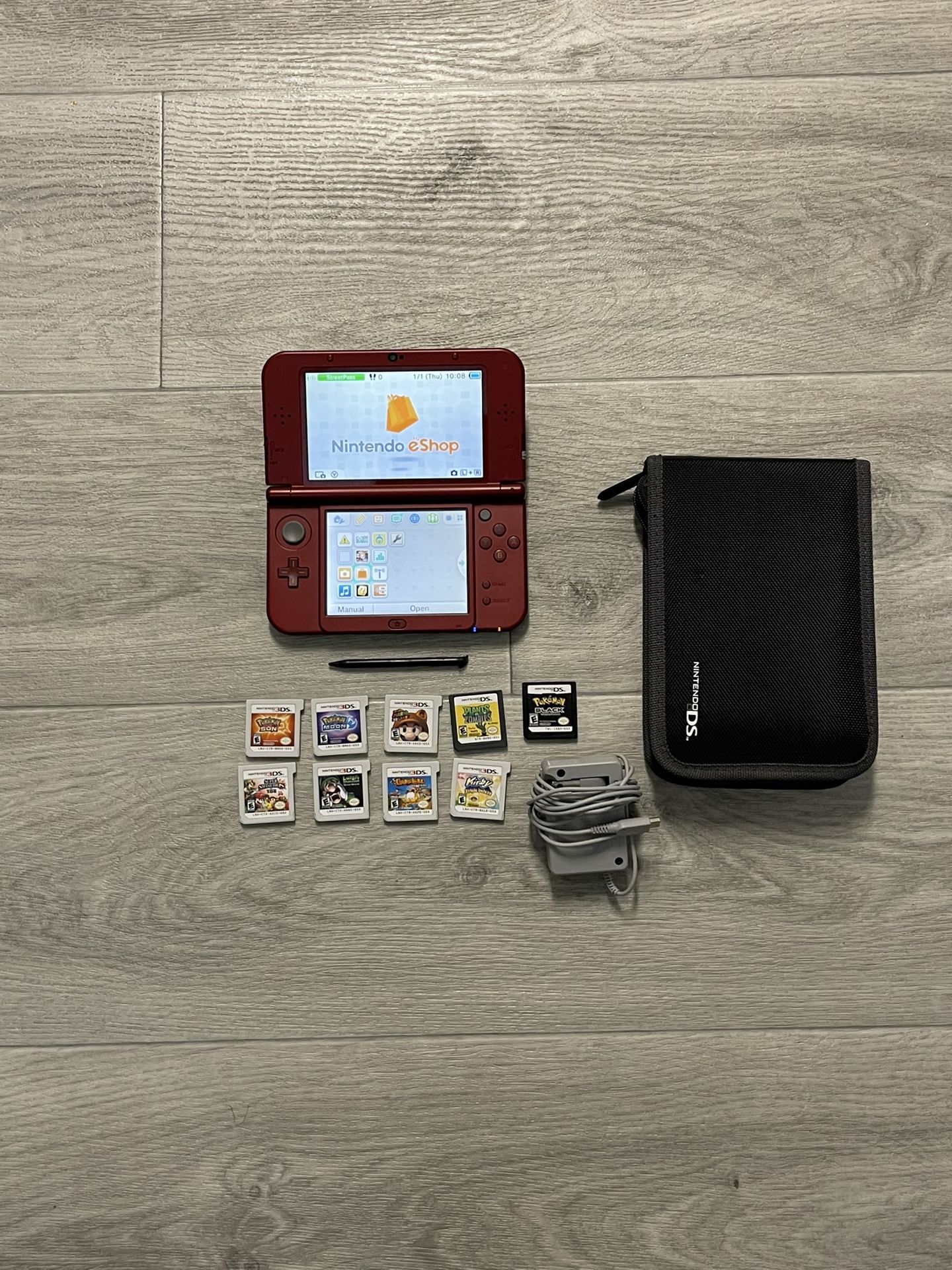 Nintendo New 3DS XL Gaming System Mint Condition + charger+ Games+case