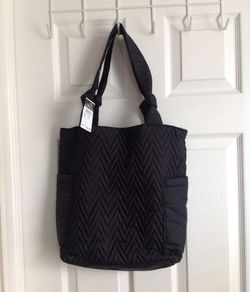 Quilted bag with outside n inside pockets, button and zip pocket